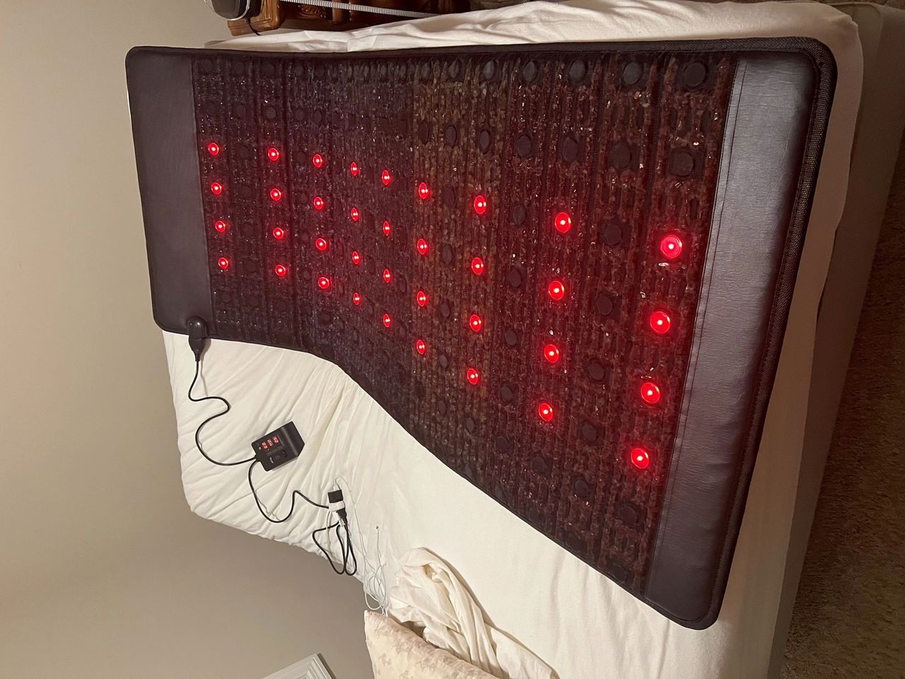 A bed with red lights on it